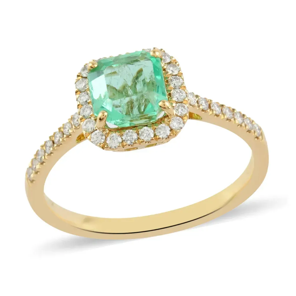 Colombian emerald halo ring set in 18K yellow gold. 
