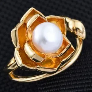 White freshwater pearl ring in floral setting, finished with 14K yellow gold.