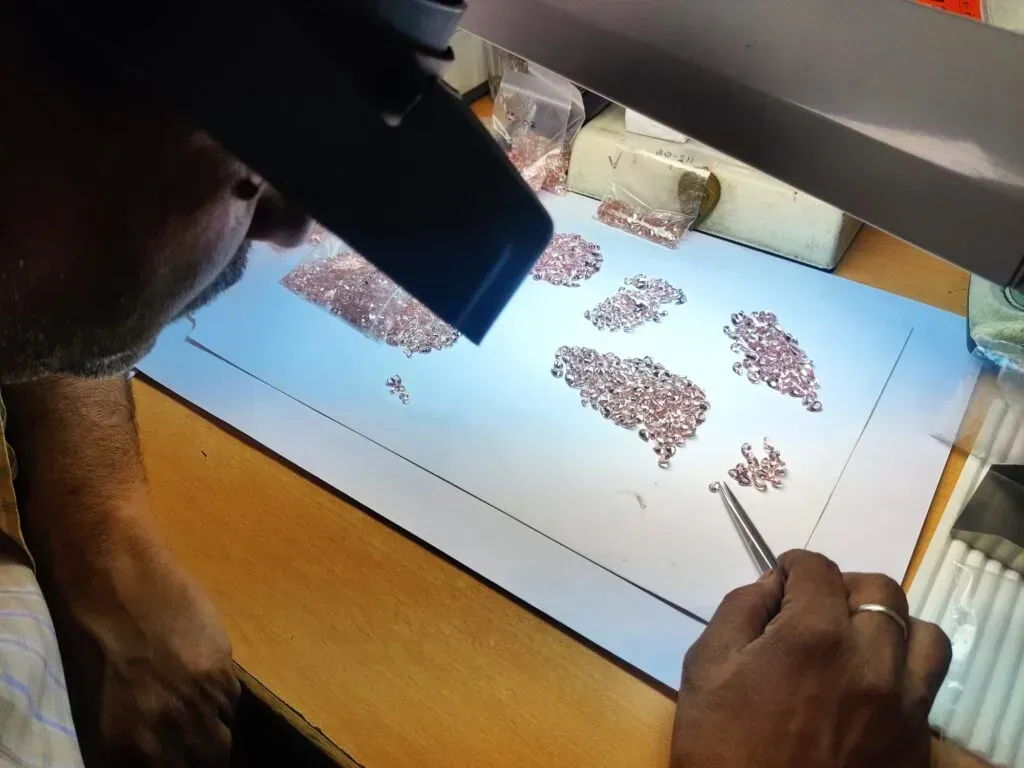 gemstone grading by a skilled artisan in India at Shop LC