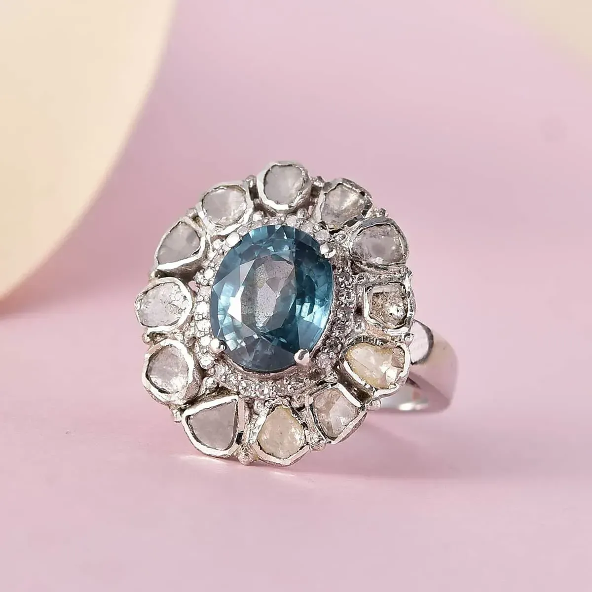Teal Grandidierite, Polki Diamond and Diamond Cocktail Ring in Platinum Over Sterling Silver, Oval Engagement Ring against a strong pink background.