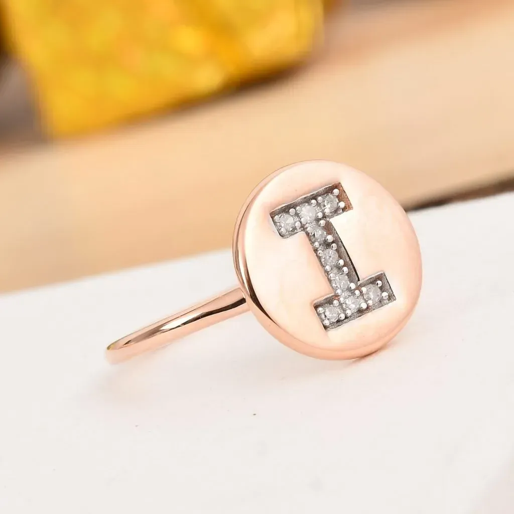 Diamond initial ring with 14K rose gold finish. 