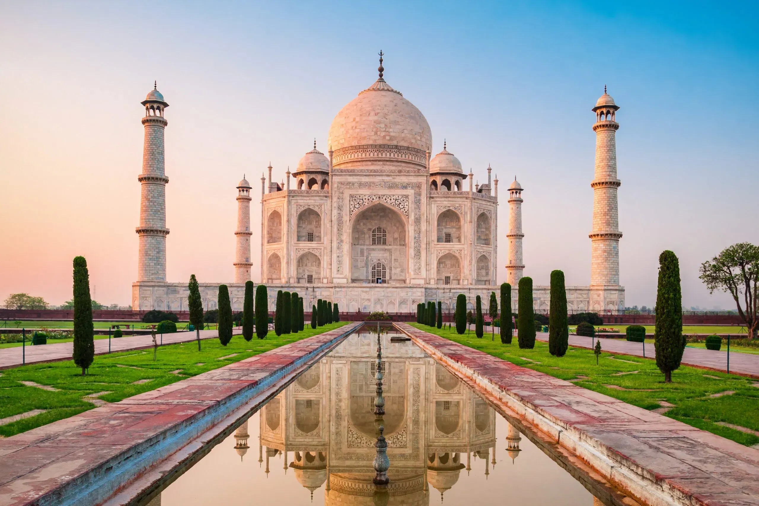 Taj Mahal is a white marble mausoleum on the bank of the Yamuna river in Agra city, Uttar Pradesh state, India
