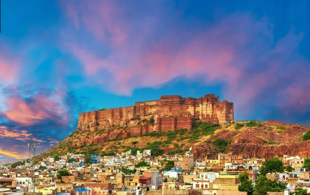 Mehrangarh Fort with Jodhpur city scape at sunset. A UNESCO World heritage site at Jodhpur, Rajasthan, India.