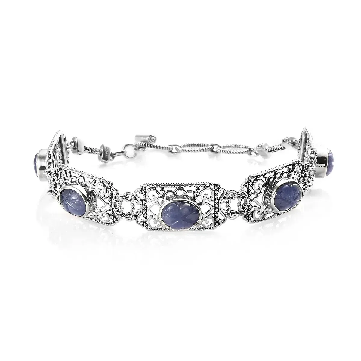 Sterling silver bracelet with carved tanzanite. 