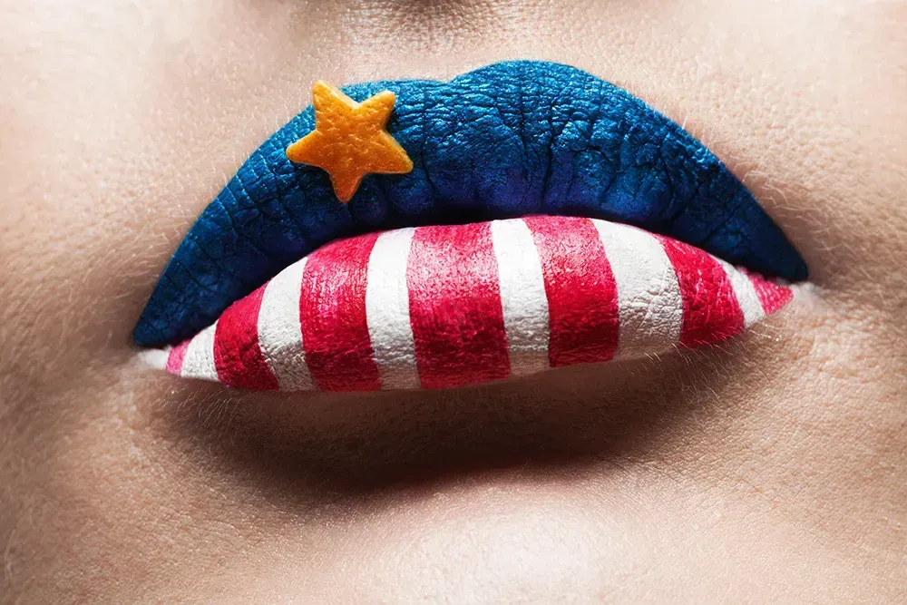 Closeup of American flag painted lips.