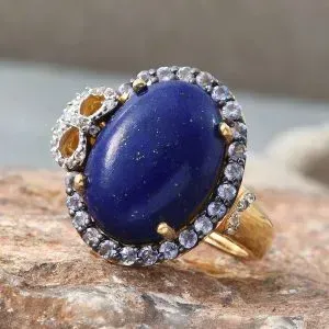 Lapis lazuli halo statement ring in sterling silver with 14K yellow gold finish.