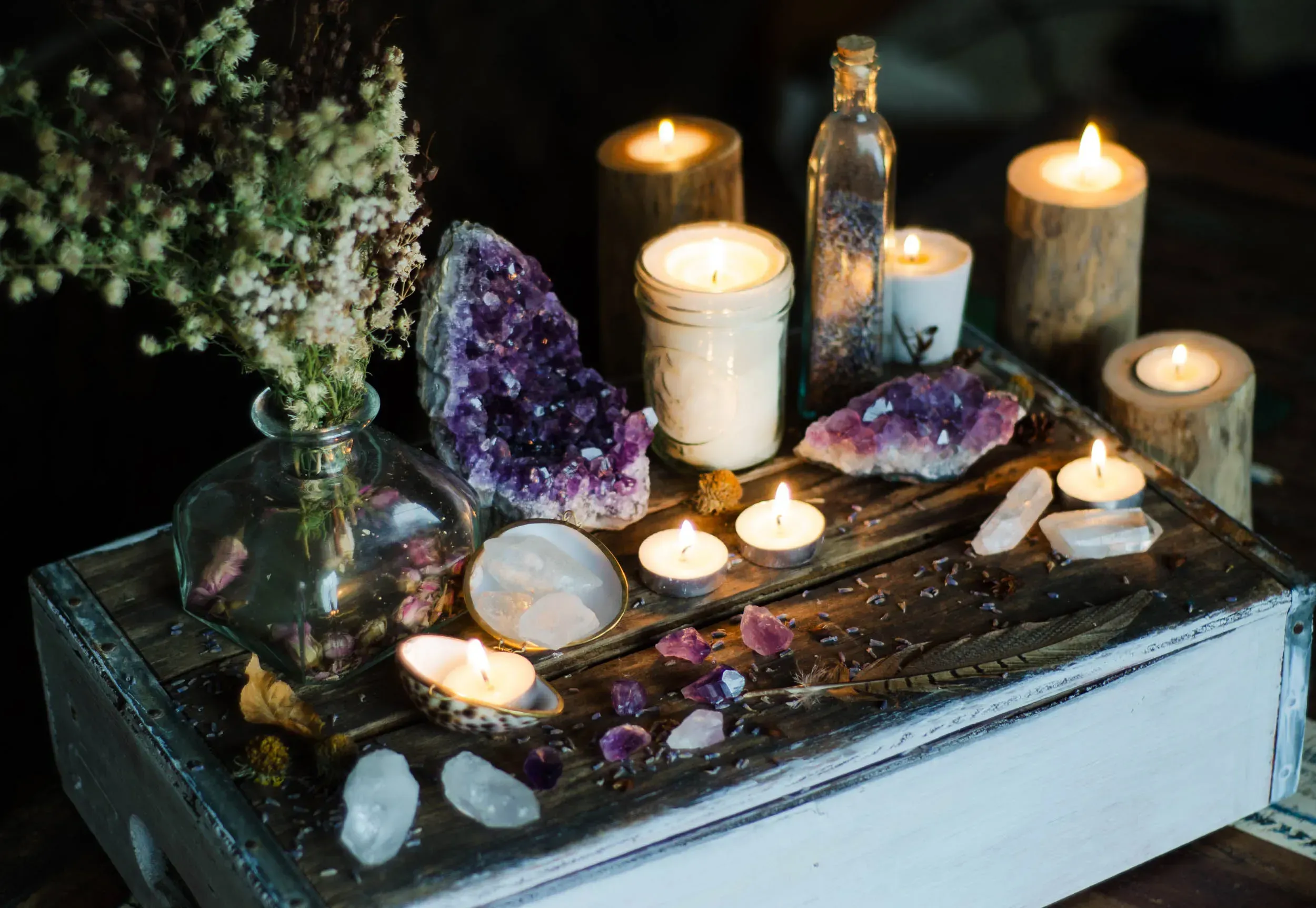 Candles and gemstones arranged for meditation.