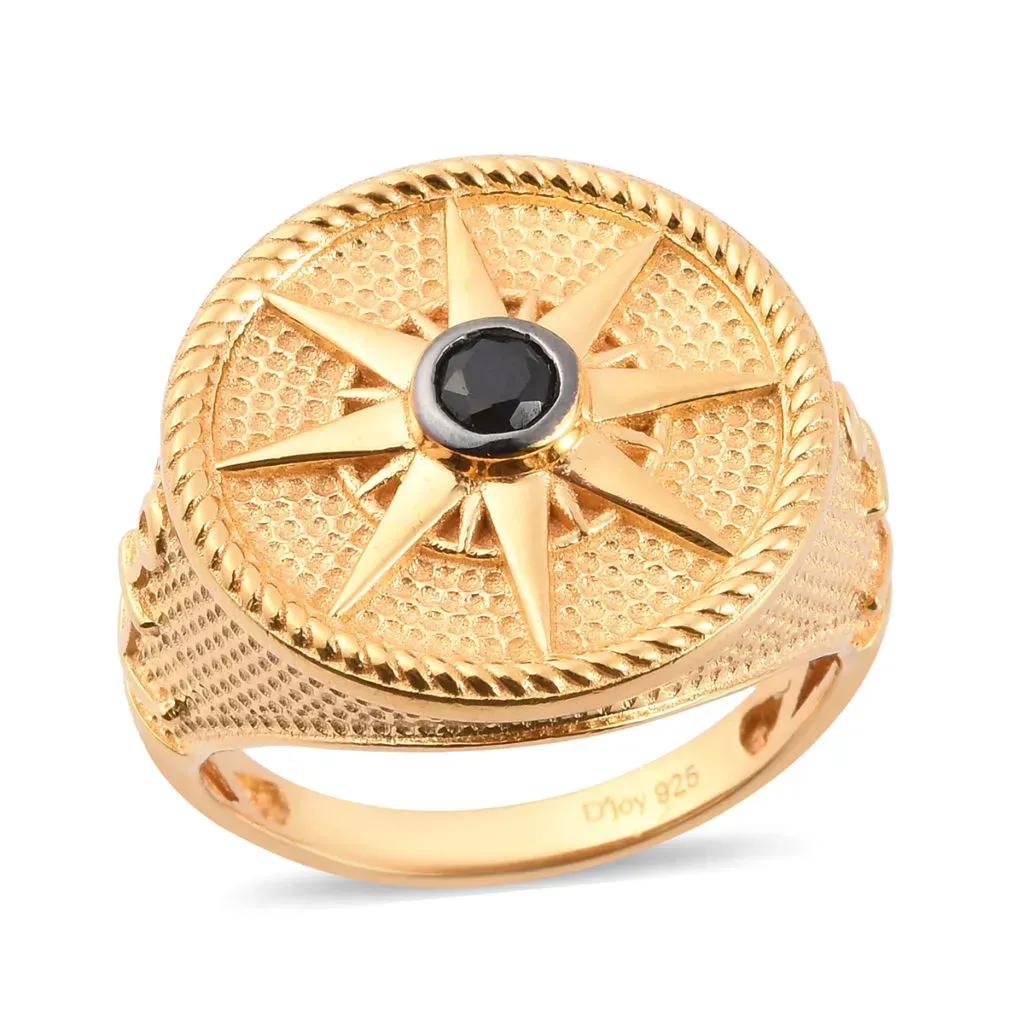 Intricate gold men's ring with black gemstone accent. 