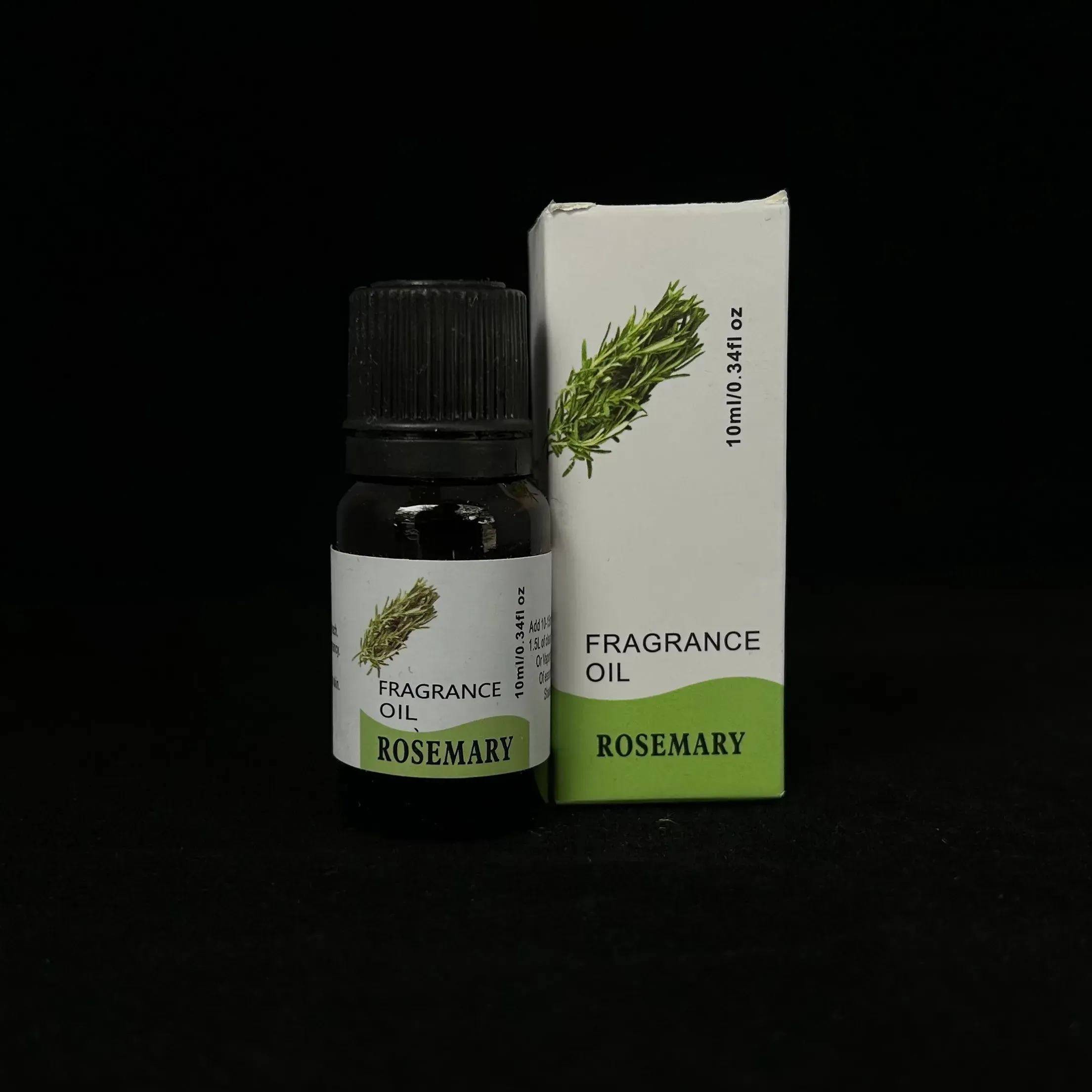 Rosemary essential oil with display box against black background.