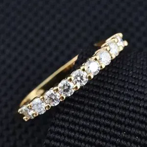 Moissanite line ring in sterling silver with 14K yellow gold finish. 
