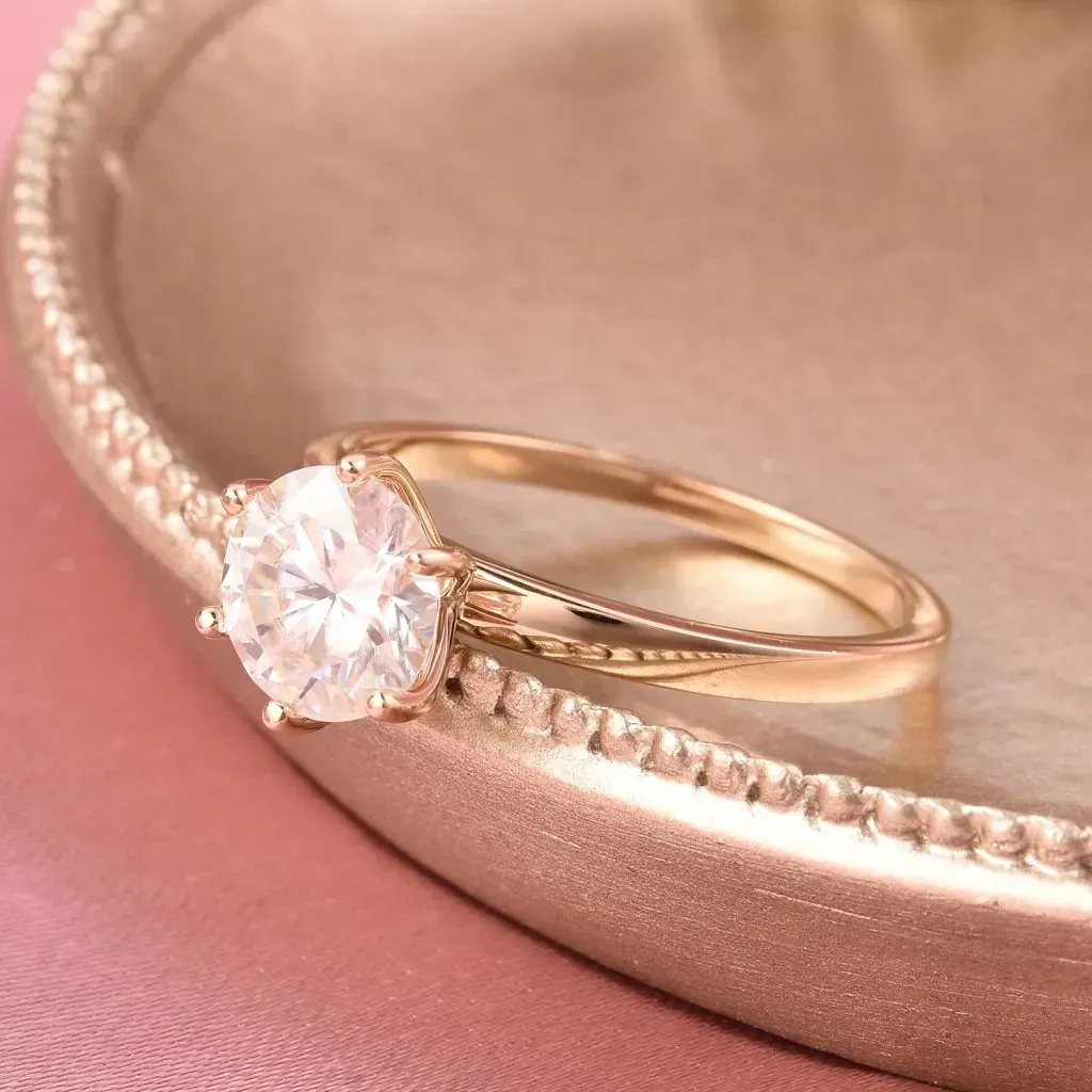 Moissanite engagement ring in 10K yellow gold. 