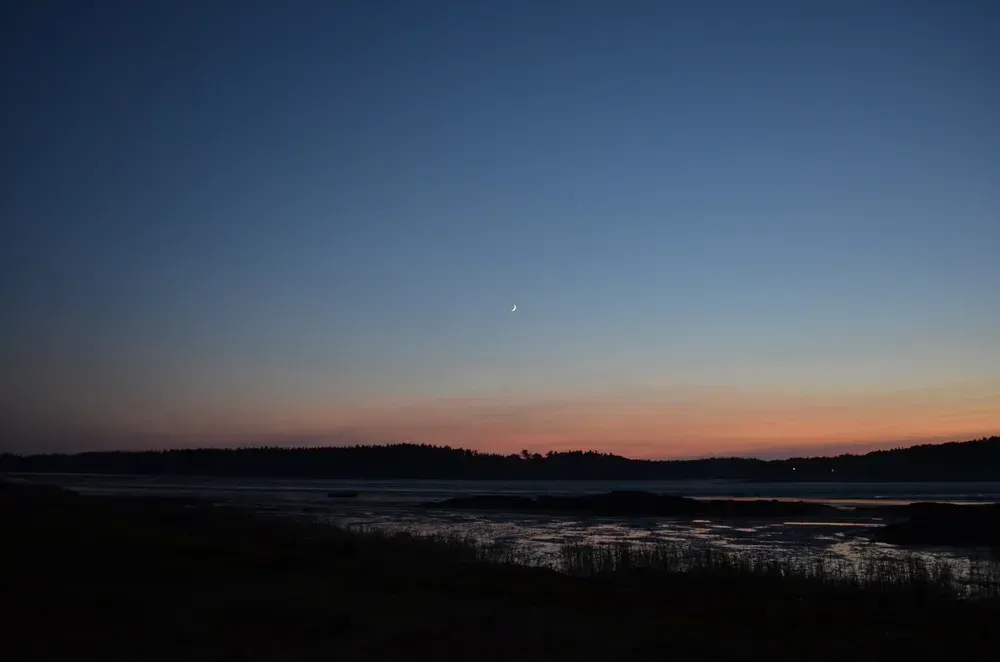 Nighttime view of the coast showing its impact on the tides.