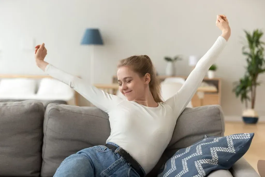 Woman waking up refreshed from a nap.