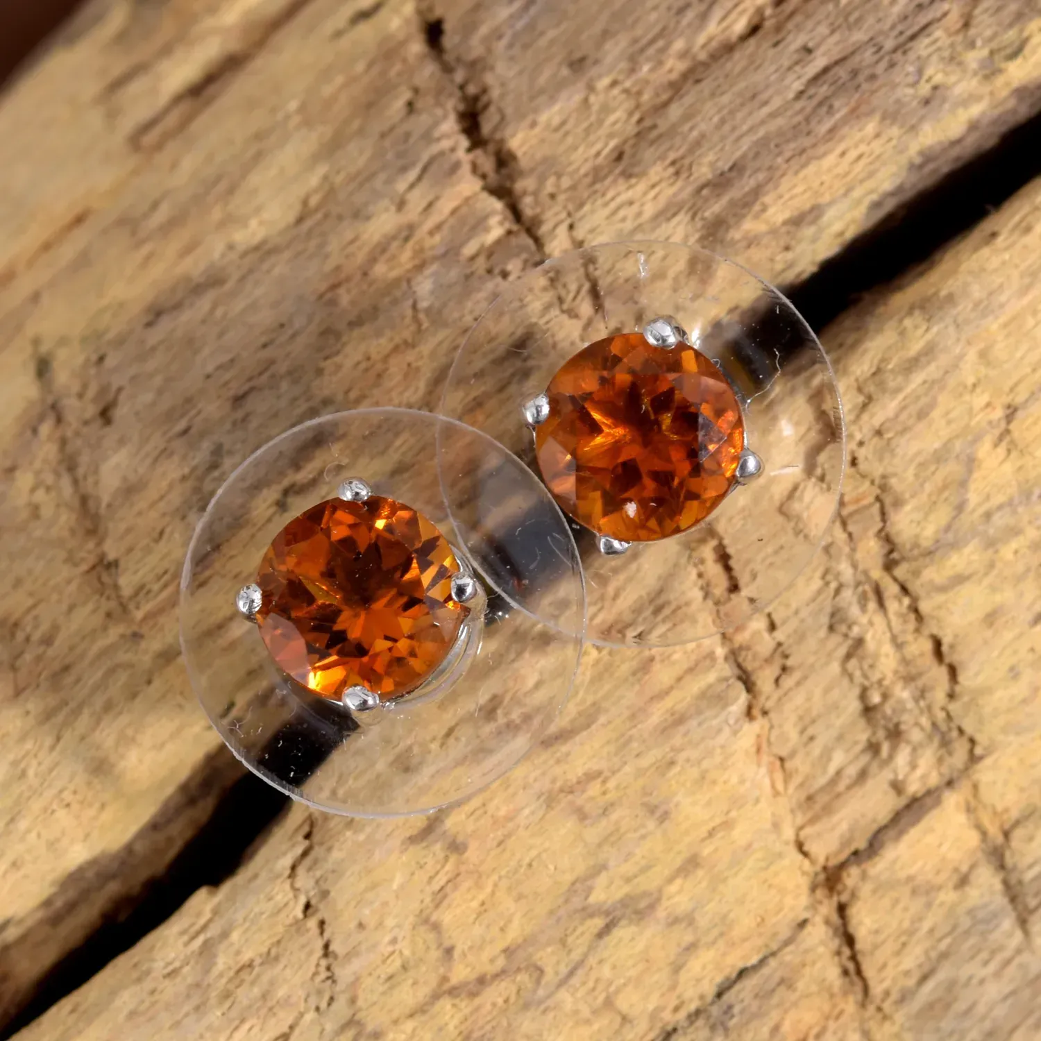Orange citrine stud earrings with prong setting. 