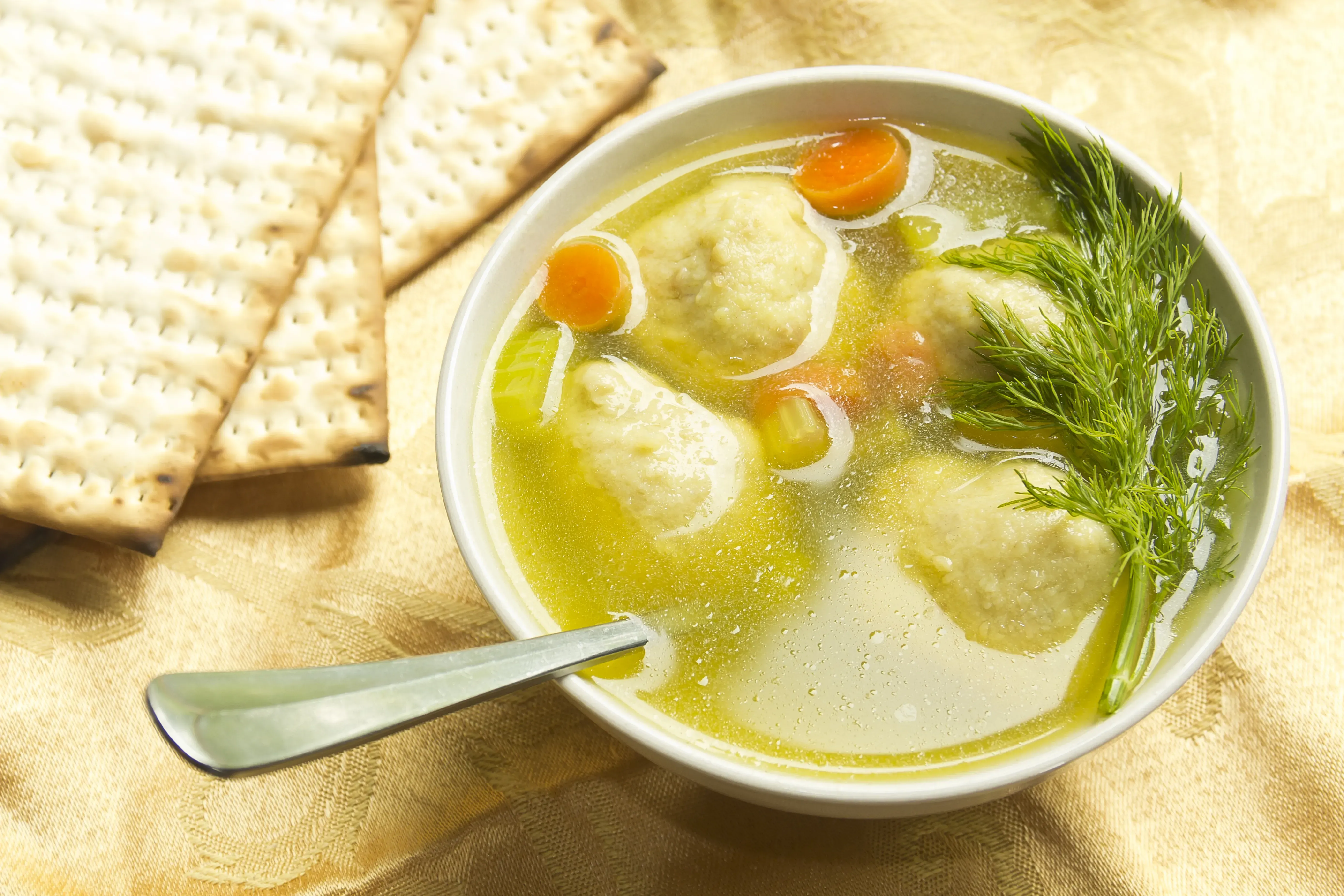 Freshly served bowl of Matzo ball soup.