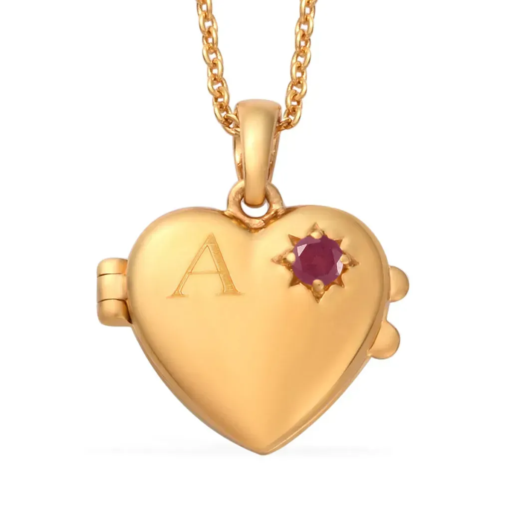 Gold heart pendant with initial and ruby birthstone accent.