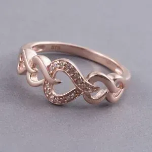 Pink diamond heart ring with 14K rose gold finish.