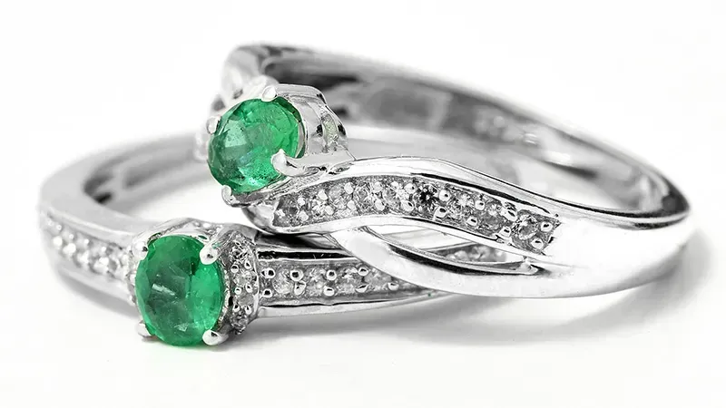 Stacked Brazilian emerald rings.