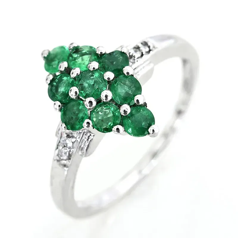 Brazilian emerald ring against white background.