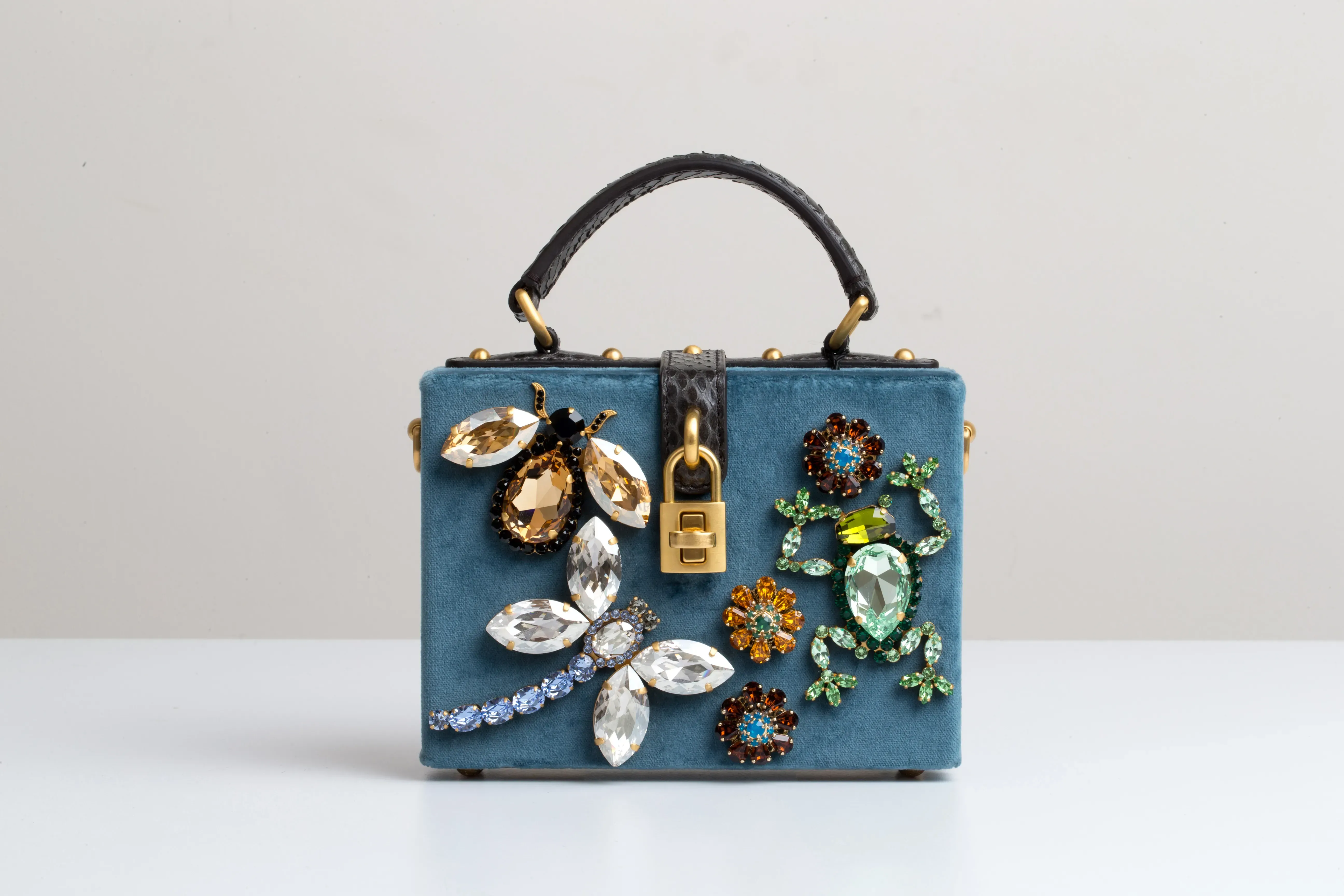 DIY bedazzled purse featuring huge gems in animal shapes.