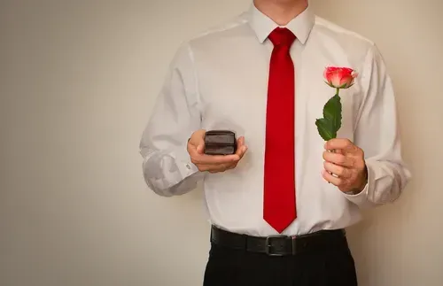 man with ring and flowers