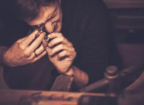 jeweler inspecting gemstone