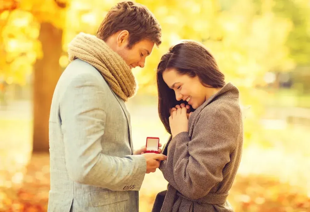 Man proposing to fiance at scene of first date.