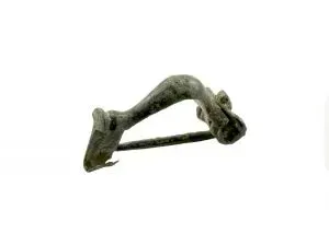 Ancient Roman fibula on white background.