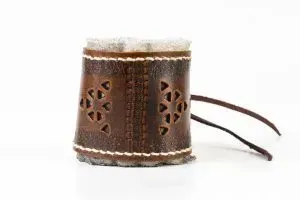 Replica Roman leather bracelet on white background.