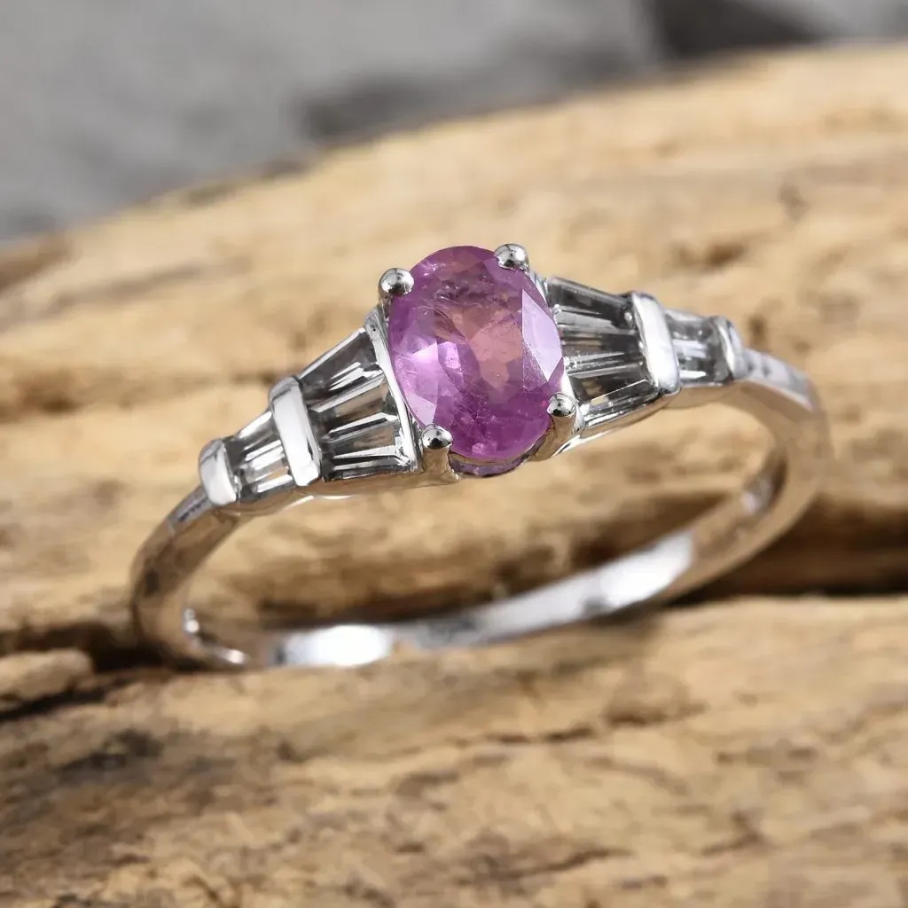 Ilakaka Hot Pink Sapphire ring on wooden base. 