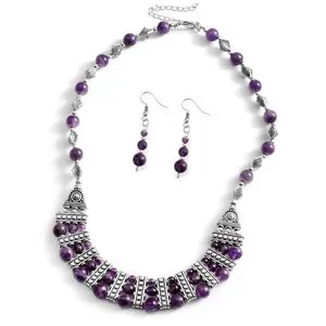 Amethyst jewelry set on white background.
