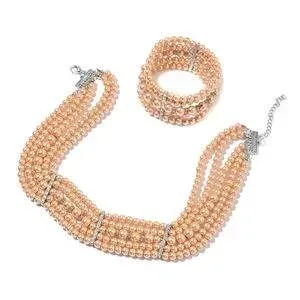 Champagne simulated pearl necklace and bracelet. 