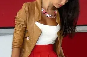 Woman in scoop top with necklace.
