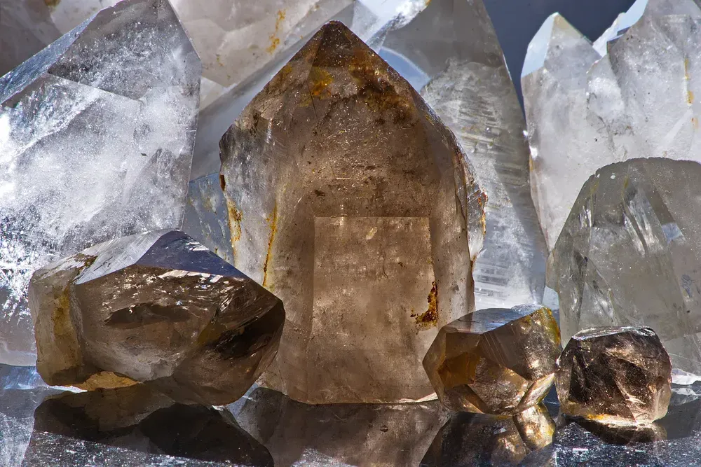 Rough smoky crystal quartz on dark background.