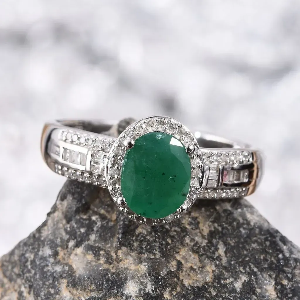 Socoto Emerald ring resting on granite rock. 