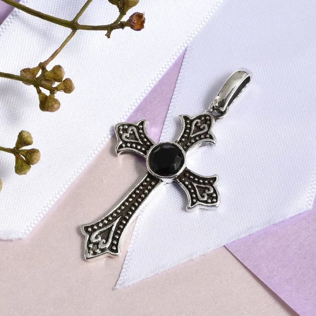 Black spinel cross pendant. 