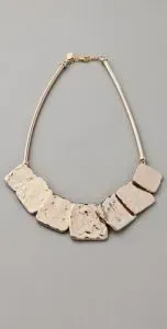Necklace with square gem accents.