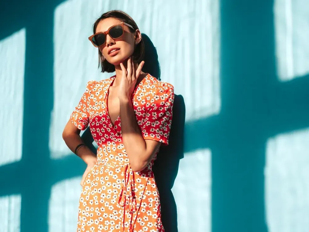 Young, beautiful, and confident woman in trendy summer red dress. 
