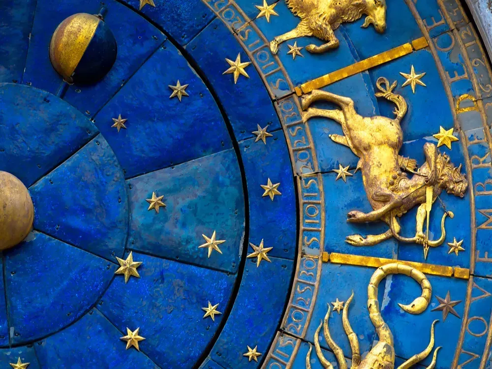 Golden symbol of Sagittarius on star circle closeup. 