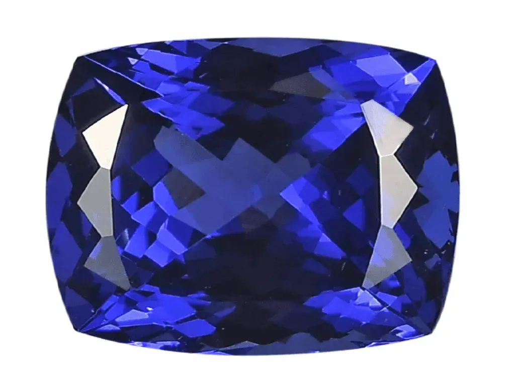 Faceted blue tanzanite on white background.