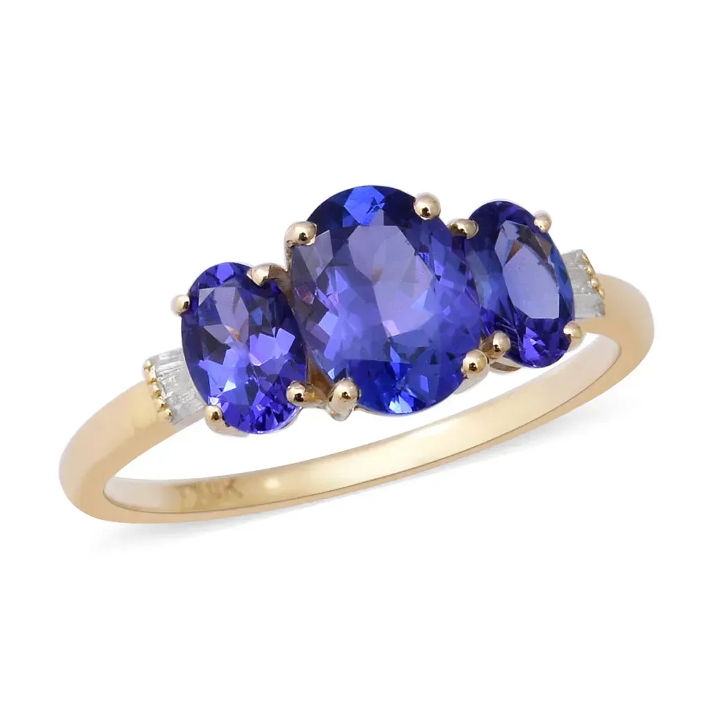 Blue three stone ring in genuine yellow gold. 