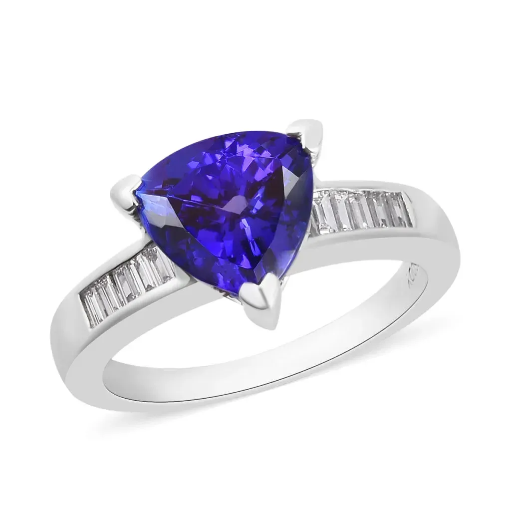 Triangle-shaped blue gemstone in platinum setting. 