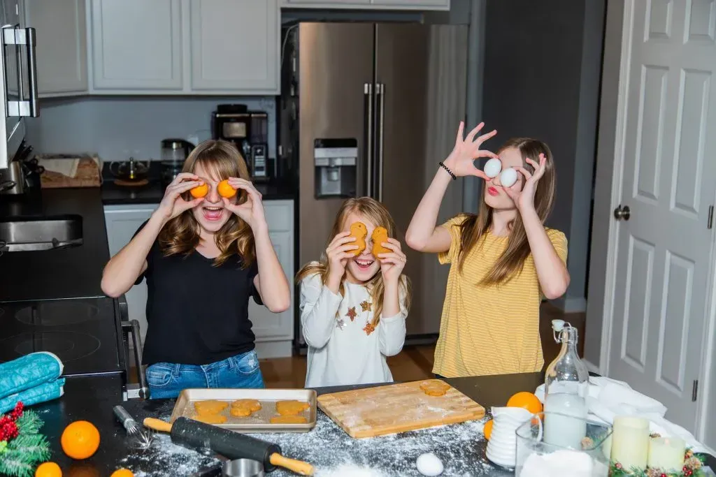 Girls having fun while cooking. 