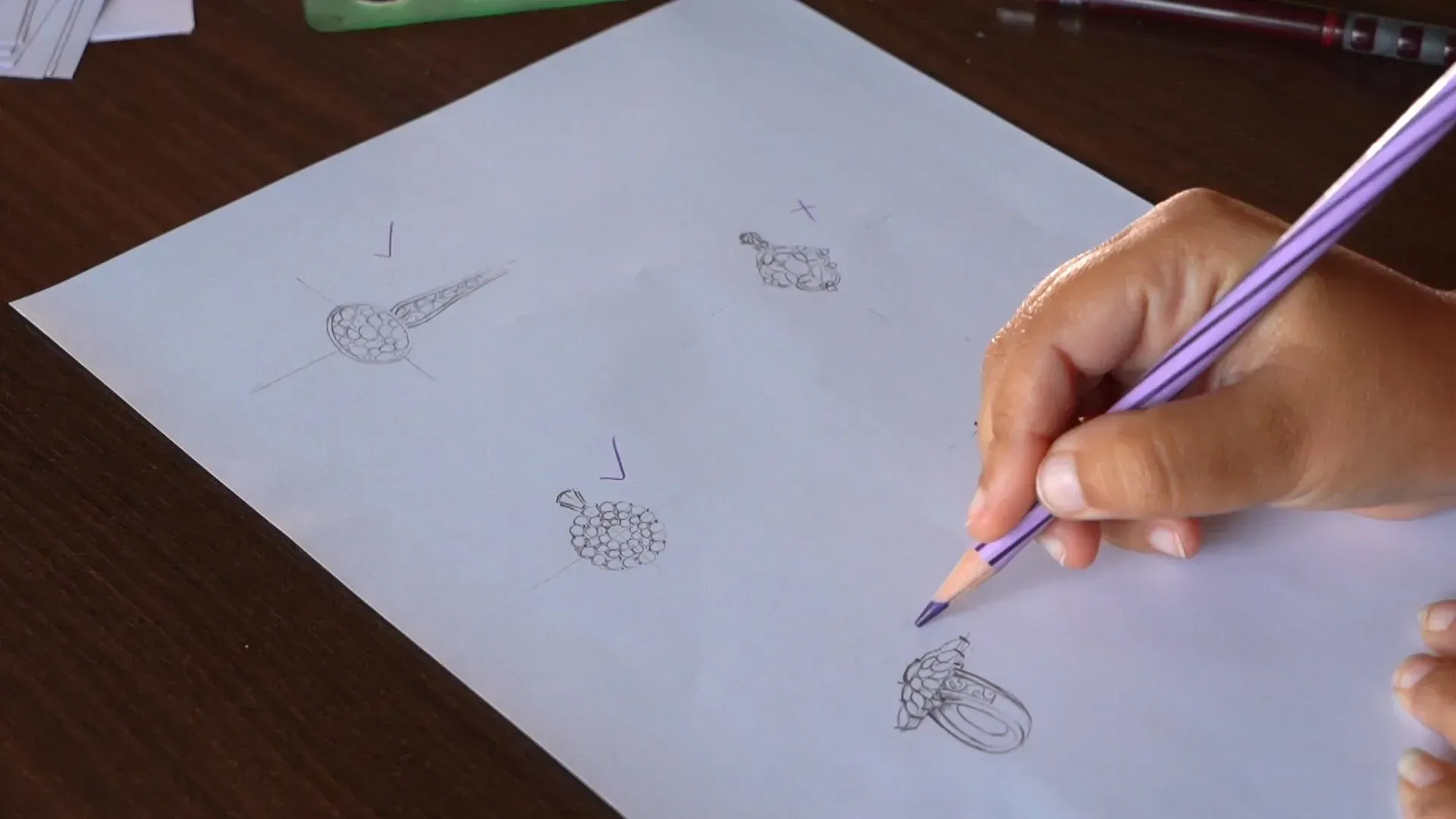 Woman sketching jewelry designs.
