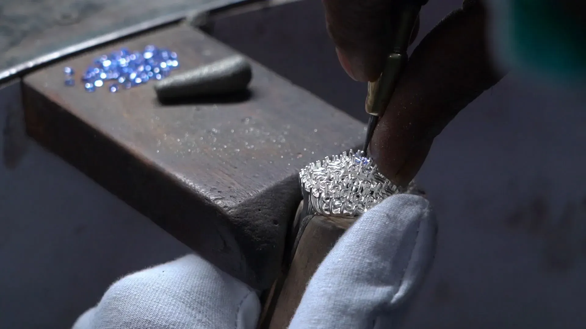 Setting gemstones within the ring.