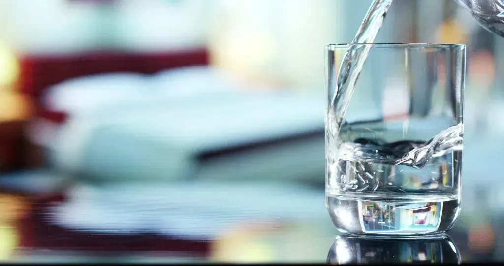 Pouring a refreshing glass of water. 