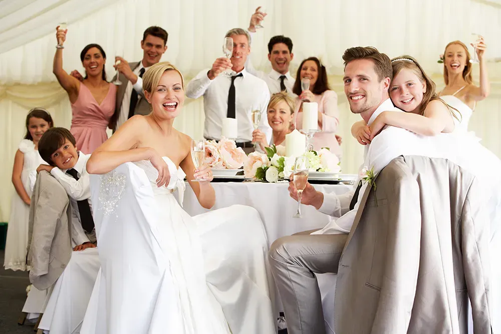 Wedding couple surrounding with loving guests.