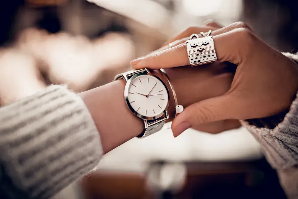 Closeup of woman checking the time.