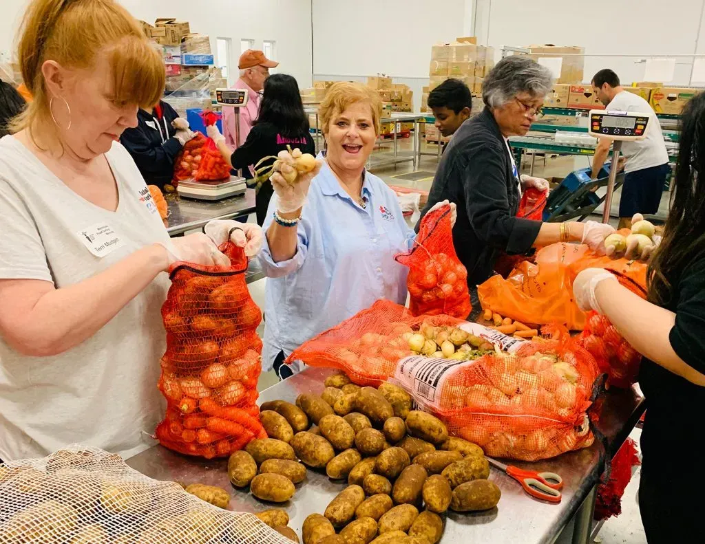 Shop LC Social Works volunteering at the Central Texas Food Bank. 