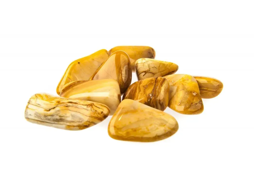 Tumbled yellow jasper gemstones.